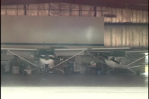 Small Airplane in Hangar Stock Footage 298335