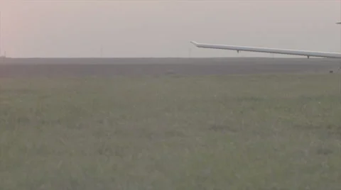 Small airplane landing at sunset - Slog3 color science Stock Footage 62442060