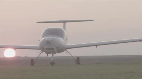 Small airplane landing at sunset - Slog3 color science Stock Footage 62442064