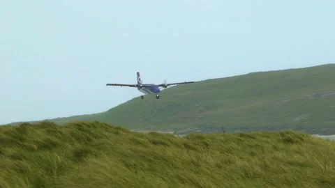 Small Airplane Lands Behind the Hill, Stormy Weather Stock Footage 156419331