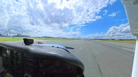 Small airplane leaving runway and taxiing at airport 動画素材 345046442