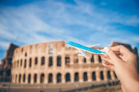 Small airplane model background Coliseum, Rome, Italy Stock Photos