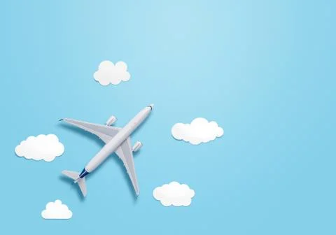 Small airplane model on the blue background with copy space Stock Photos