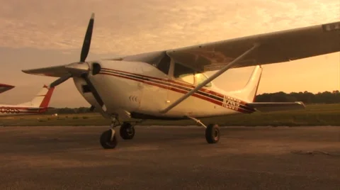 Small airplane parked at airport Stock Footage