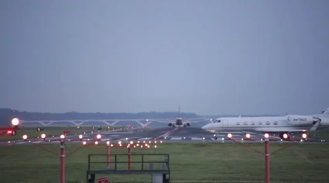 Small airplane taking off at night, DCA Reagan National Airport Washington DC Stock Footage 65218763