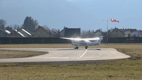 Small airplane taking off on a windy day Stock Footage 151140285