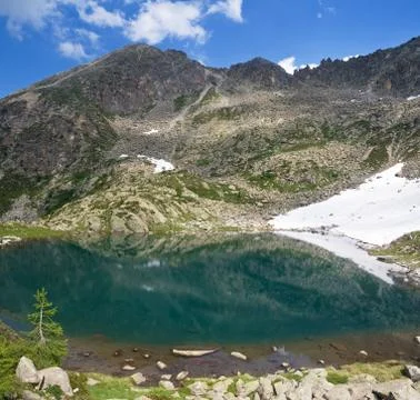 Small alpine lake Stock Photos