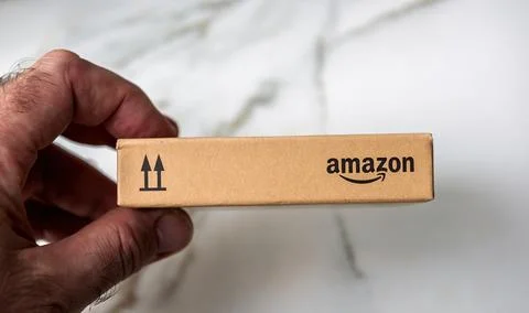 Small Amazon Package in Hand Stock Photos