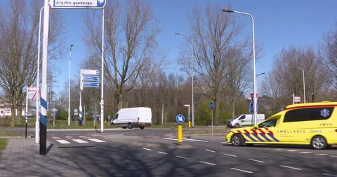 Small ambulance, based on a passenger car, carefully takes an exit Stock Footage 127488862