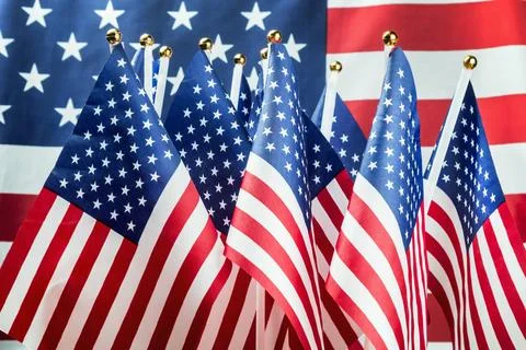 Small American flags in the background Stock Photos