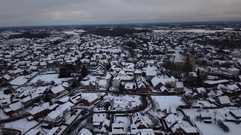 Small American town snow-covered after snowfall on grey Winter day. Aerial Видео 326721832