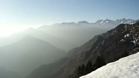 Small Amount of Snow on Top of The Hill Surrounded With Alps. Видео 168253061