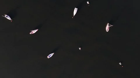 Small Anchored Yachts Floating in Tranquil Coastal Waters, Top-down Aerial Stock-Footage 339301181
