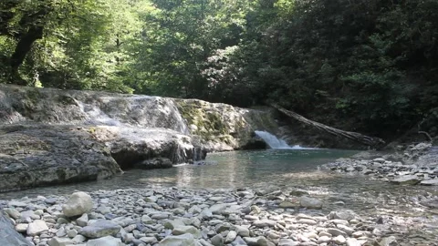 A small and beautiful waterfall in a deep gorge. Stock Footage 161816830