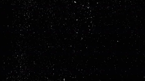 Small and big dust particles descending slowly like snow on black background, 4k Stock-Footage 68770429
