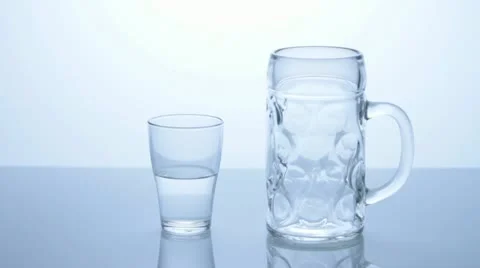 A small and a big glass Stock Footage 11610984