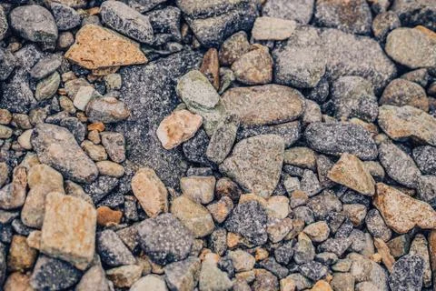Small and big smooth round pebbles, sea dry stones, multicolour gray gravel Stock Photos
