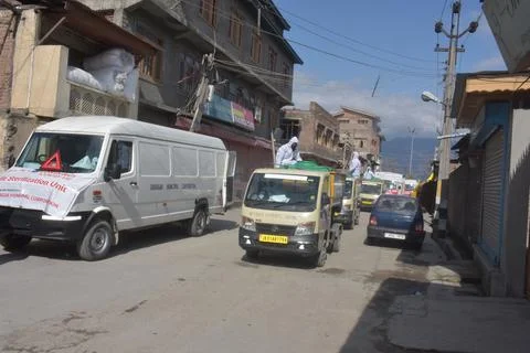 Small and big vehicles are fumigation villages townes during covid-19 Stock Photos
