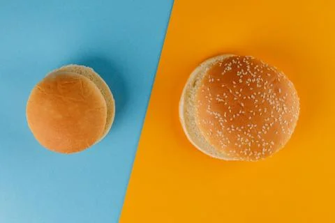 Small and classic bun empty isolated. American food classic round burger brea Stock Photos