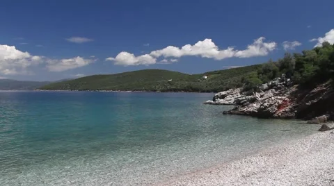 Small and deserted beach with rocks Stock Footage 40353684