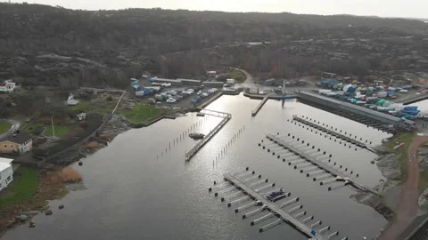 Small and Empty Harbor with Winterized Boats Ashore, Aerial Ascending Stock Footage 145396670