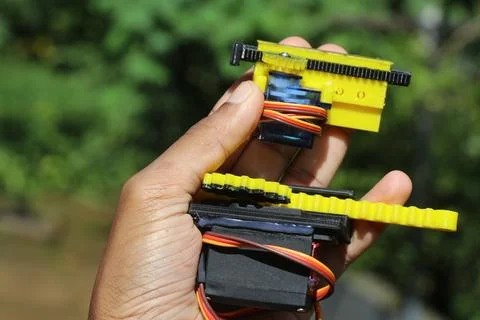 Small and medium sized servo with its shaft connected to 3d printed slider Stock Photos
