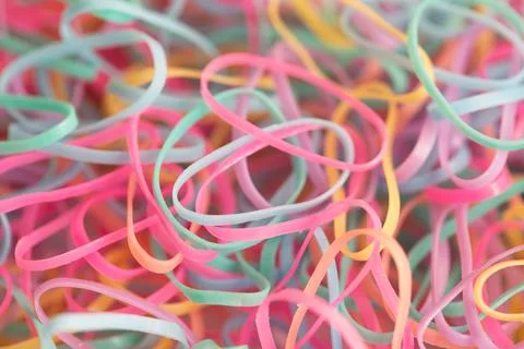 Small and multicolored rubber bands accessories background Stock Photos
