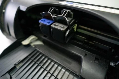 Small and simple printer for printing paper documents - Stock Photos