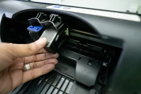 Small and simple printer for printing paper documents - Stock Photos