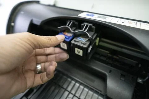 Small and simple printer for printing paper documents - Stock Photos