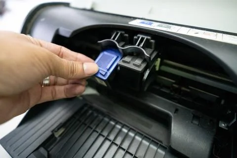 Small and simple printer for printing paper documents - Stock Photos