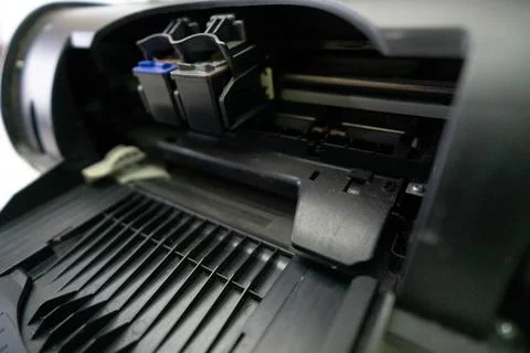 Small and simple printer for printing paper documents - Stock Photos