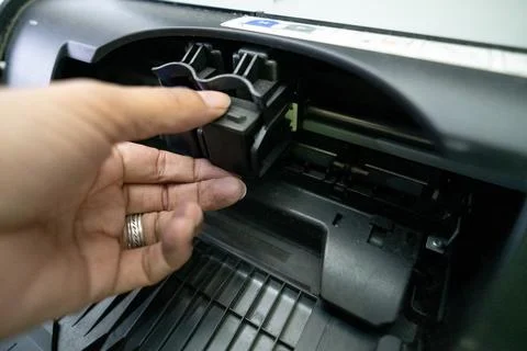 Small and simple printer for printing paper documents - Stock Photos