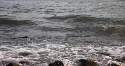 Small and soft ocean or sea wave or setup on rocky beach Stock Footage 158097929
