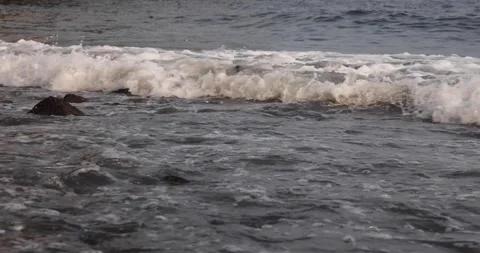 Small and soft ocean or sea wave or setup on rocky beach Stock Footage 158097935