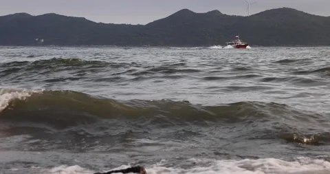 Small and soft ocean or sea wave or setup on rocky beach Stock Footage 158097959