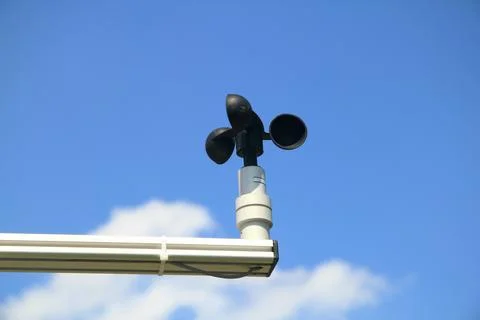 A small anemometer, blue sky in the background Stock Photos