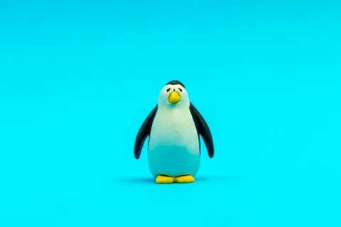Small animal figure toy for children on a blue background isolated Stock Photos