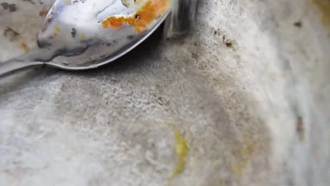 Small ants in a frying pan with a spoon. Stock Footage 245933938