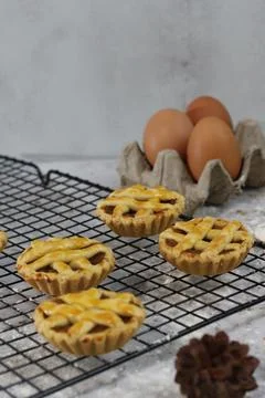 Small apple pie served on a cake rack, tastes sweet and savory. Food concep.. Stock Photos