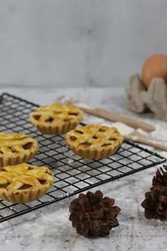 Small apple pie served on a cake rack, tastes sweet and savory. Food concep.. Stock Photos