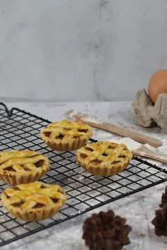 Small apple pie served on a cake rack, tastes sweet and savory. Food concep.. Stock Photos