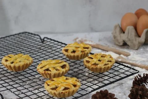 Small apple pie served on a cake rack, tastes sweet and savory. Food concep.. Stock Photos