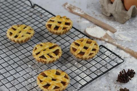 Small apple pie served on a cake rack, tastes sweet and savory. Food concep.. Stock Photos