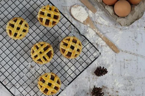 Small apple pie served on a cake rack, tastes sweet and savory. Food concep.. Stock Photos