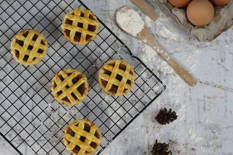 Small apple pie served on a cake rack, tastes sweet and savory. Food concep.. Stock Photos