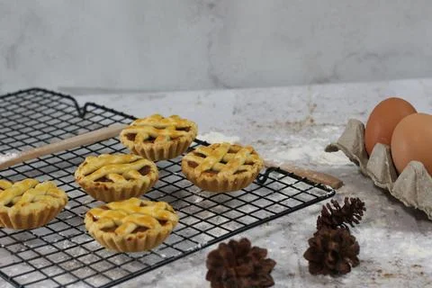 Small apple pie served on a cake rack, tastes sweet and savory. Food concep.. Stock Photos