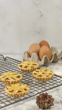 Small apple pie served on a cake rack, tastes sweet and savory. Food concep.. Stock Photos