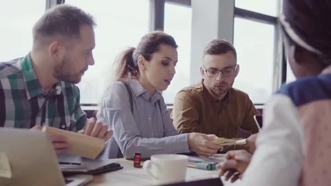 Small architectural company working at project. Creative business meeting of Stock Footage 84327995