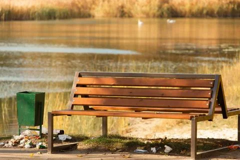 Small architectural objects in the form of a bench and a trash can Stock Photos